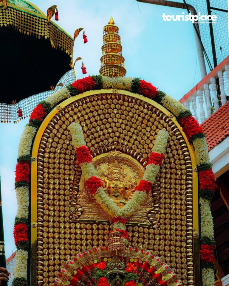 Decorated temple idol panel with floral garlands during Thrissur Pooram festival in Kerala India