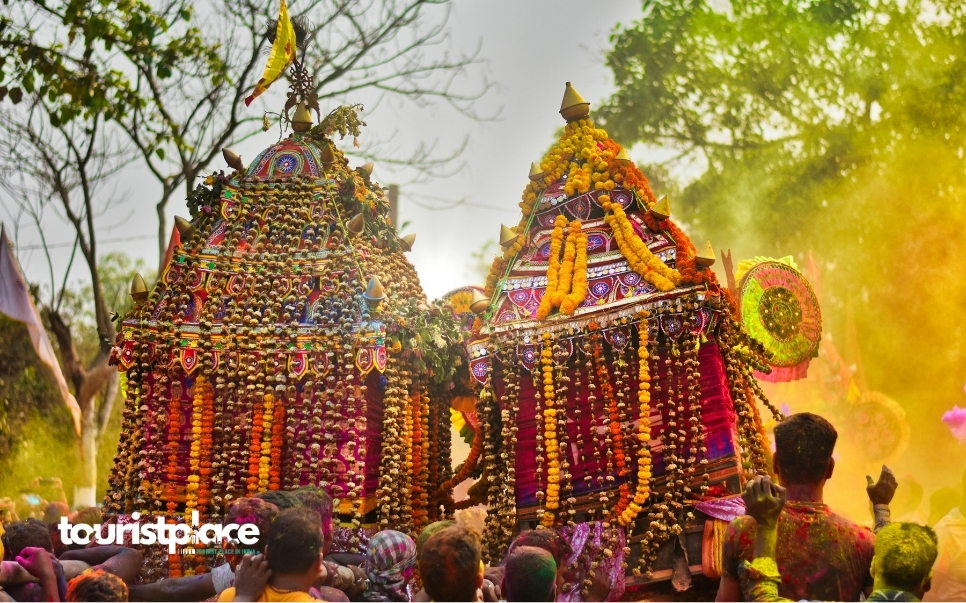 Devotees celebrating Rath Yatra with decorated chariots and vibrant colors - Tourist Place In India